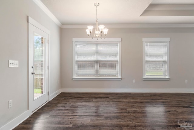 2748 Woodman Loop, Cantonment, FL 32533 - unfurnished dining area featuring plenty of natural light, a chandelier, crown molding, dark wood-style floors, and baseboards