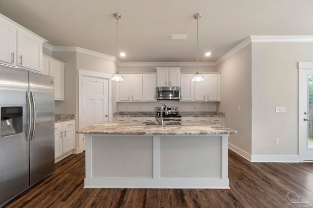 2748 Woodman Loop, Cantonment, FL 32533 - kitchen with stainless steel appliances, a sink, ornamental molding, dark wood-style flooring, and white cabinets