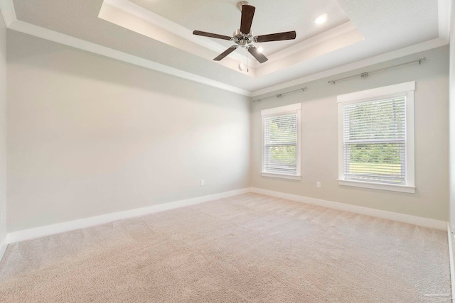 2748 Woodman Loop, Cantonment, FL 32533 - unfurnished room with a raised ceiling, baseboards, light colored carpet, and ceiling fan