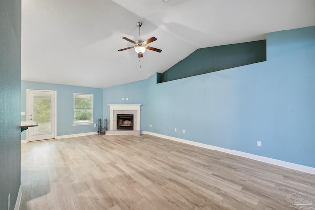 unfurnished living room featuring light hardwood / wood-style floors, ceiling fan, and lofted ceiling