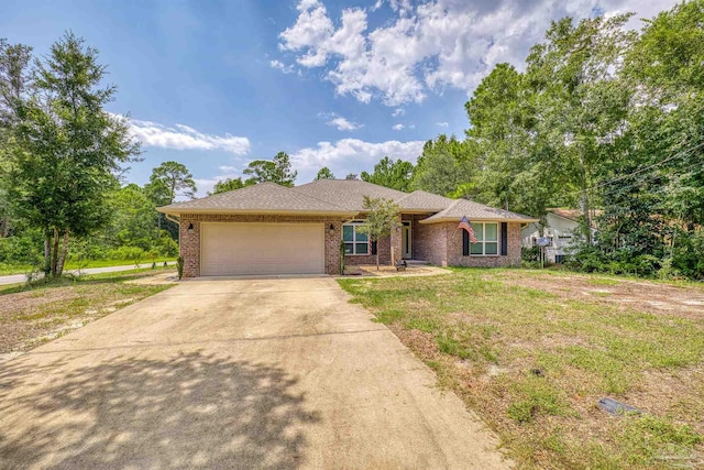 ranch-style home with a garage and a front lawn