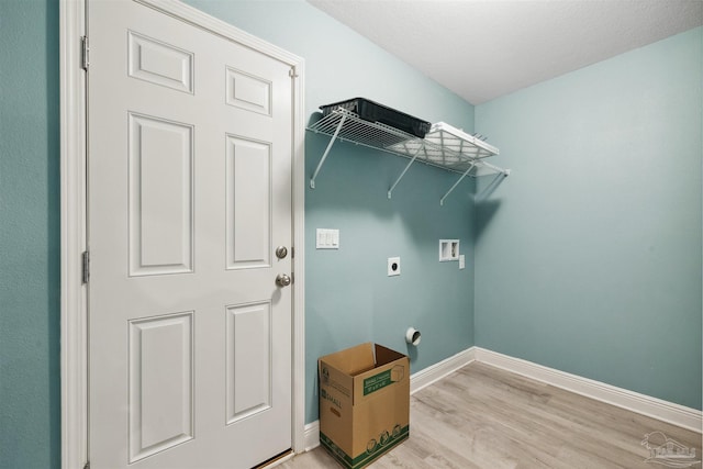 laundry room featuring light hardwood / wood-style flooring, hookup for a washing machine, and hookup for an electric dryer