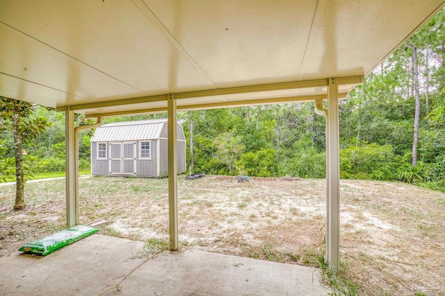 view of patio / terrace featuring a shed