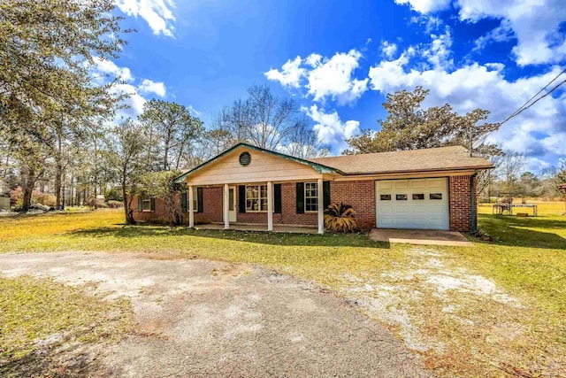 ranch-style house with a porch, driveway, an attached garage, and a front yard