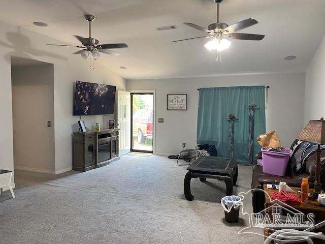 living room with carpet flooring, ceiling fan, and lofted ceiling