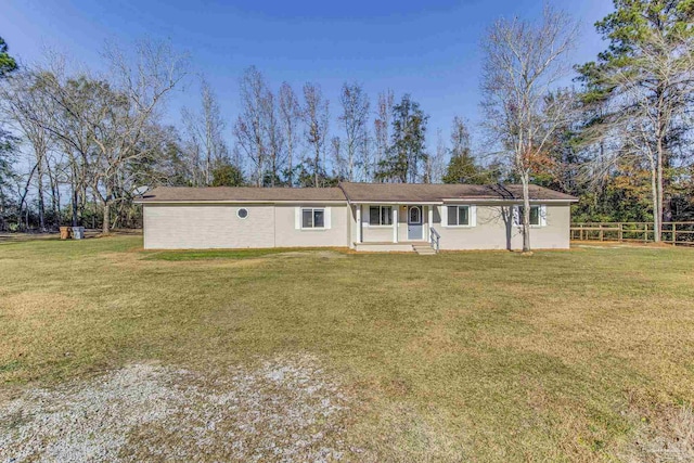 ranch-style house with a front lawn