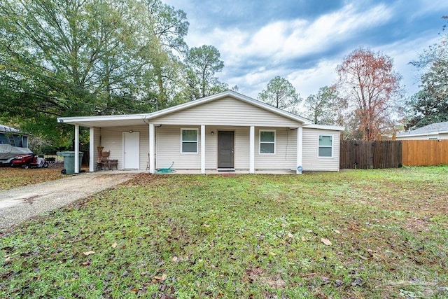 view of front of house featuring a front lawn and a carport