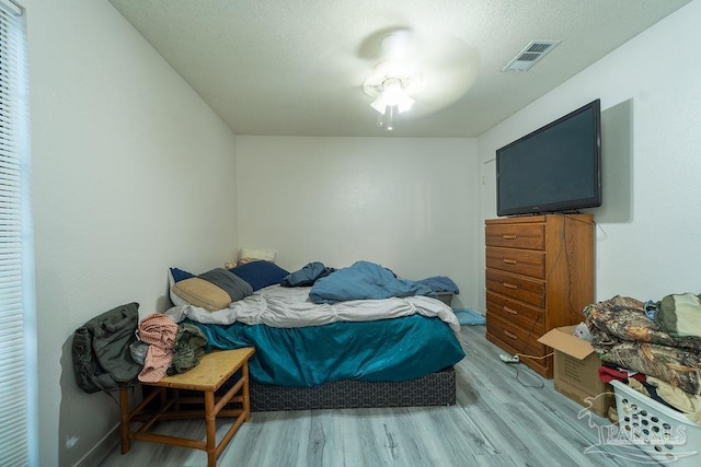 bedroom with light hardwood / wood-style floors