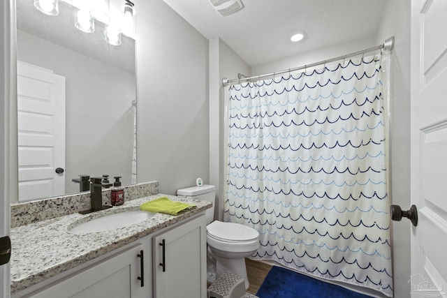 3897 James Stovall St, Pensacola, FL 32526 - full bathroom featuring toilet, vanity, a shower with shower curtain, wood finished floors, and recessed lighting