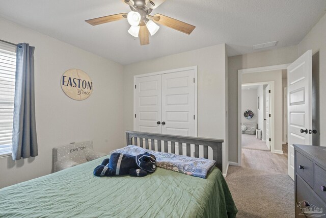 3897 James Stovall St, Pensacola, FL 32526 - carpeted bedroom featuring a closet, a ceiling fan, and baseboards