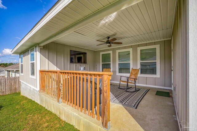 3897 James Stovall St, Pensacola, FL 32526 - view of patio with a ceiling fan, fence, and a deck