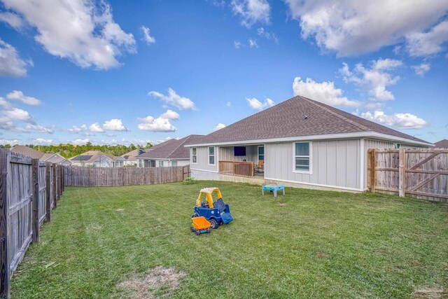 3897 James Stovall St, Pensacola, FL 32526 - rear view of house with roof with shingles and board and batten siding