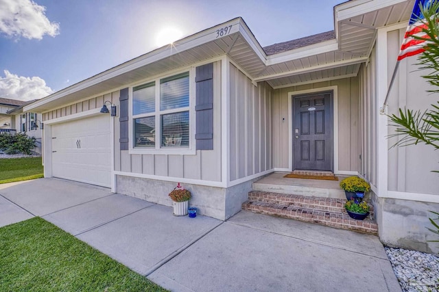 view of exterior entry with a garage