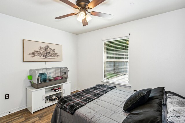 bedroom featuring dark hardwood / wood-style flooring and ceiling fan