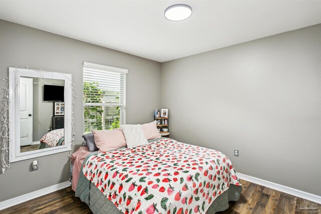 bedroom featuring dark wood-type flooring