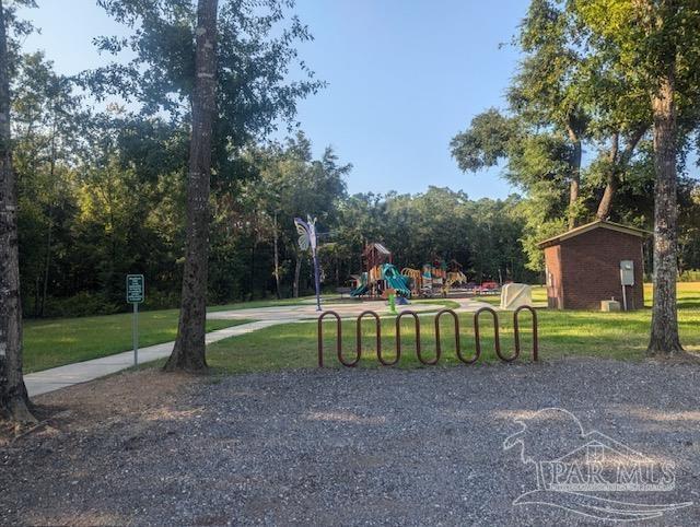 view of jungle gym with a lawn