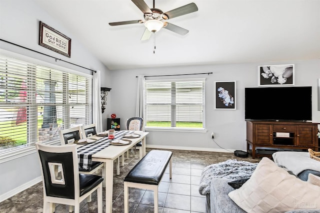 tiled living room with lofted ceiling and ceiling fan