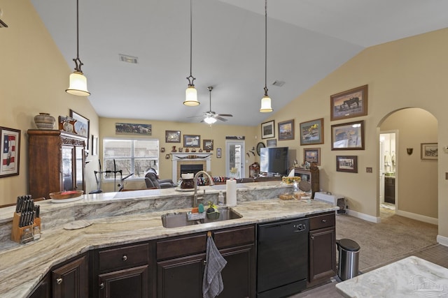 kitchen with dark brown cabinets, black dishwasher, sink, and hanging light fixtures