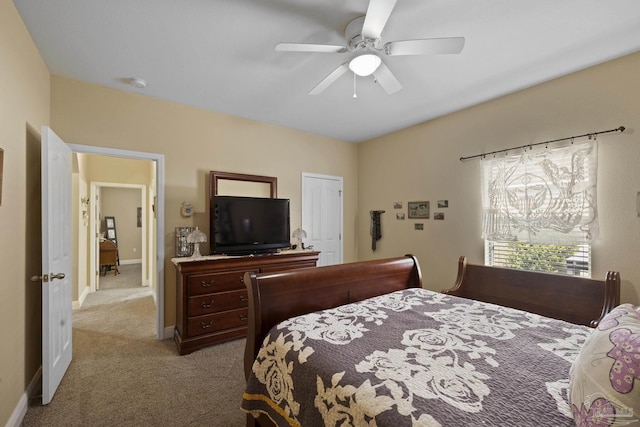 bedroom featuring light colored carpet and ceiling fan