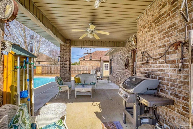 view of patio / terrace with area for grilling, an outdoor living space, a fenced in pool, and ceiling fan