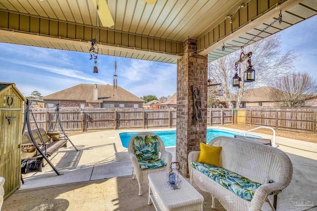 view of patio / terrace with a fenced in pool