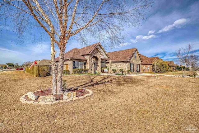 ranch-style house with a front yard