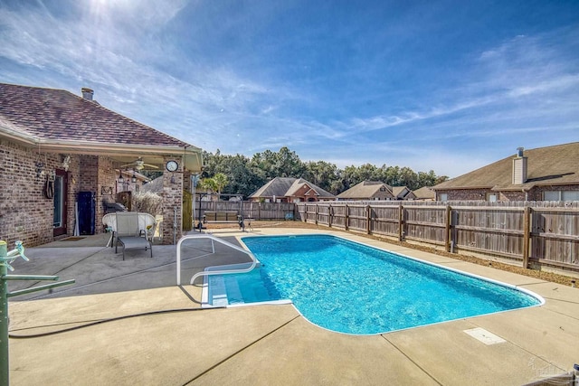 view of swimming pool with a patio area