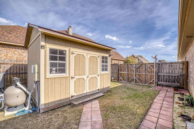 view of outdoor structure with a lawn