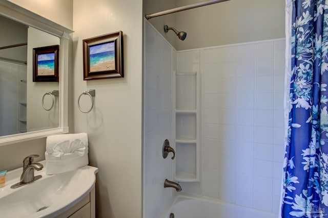bathroom featuring shower / bathtub combination with curtain and vanity