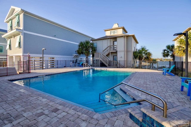 view of pool featuring a patio