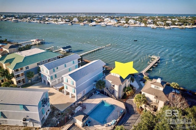 birds eye view of property with a water view