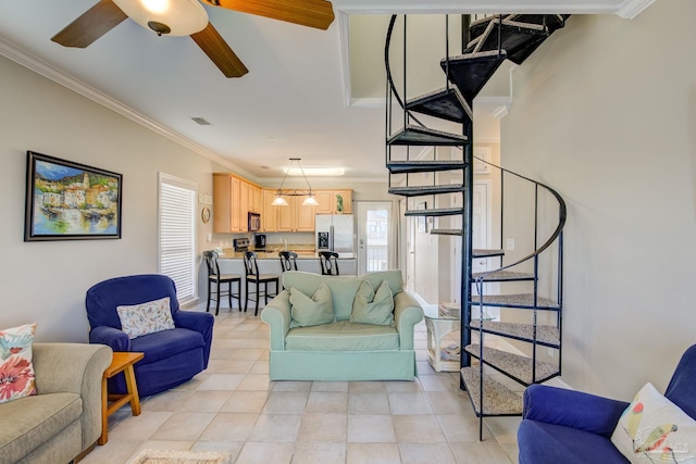 tiled living room with crown molding and ceiling fan