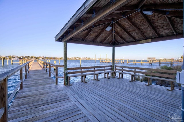 view of dock featuring a gazebo and a water view