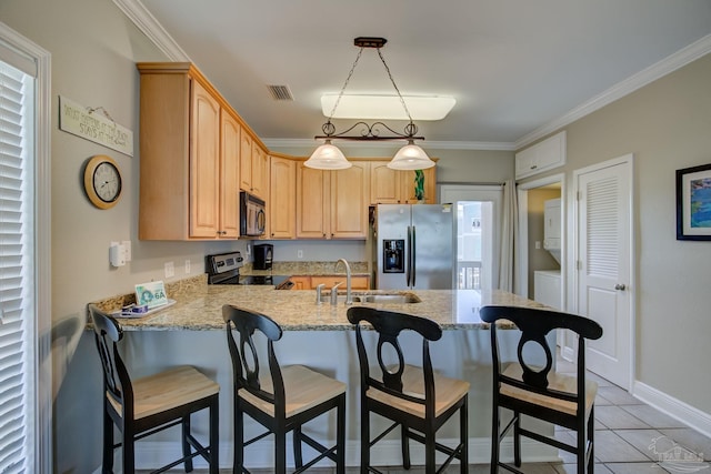 kitchen with light brown cabinetry, sink, ornamental molding, pendant lighting, and stainless steel appliances