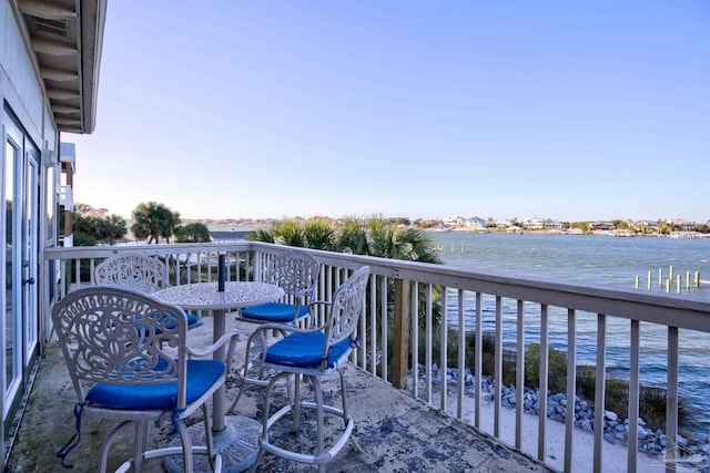 balcony with a deck with water view