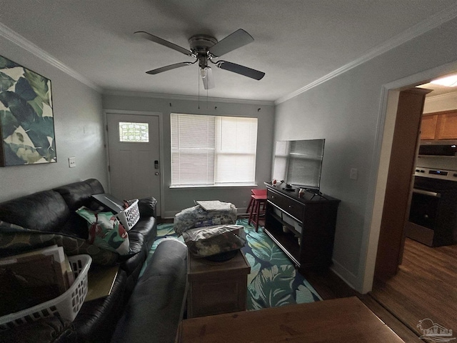 living room with dark hardwood / wood-style flooring, crown molding, and ceiling fan