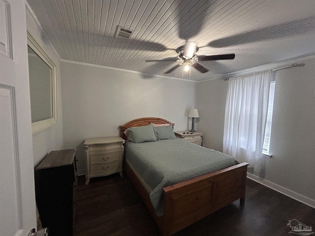 bedroom with crown molding, dark hardwood / wood-style floors, wooden ceiling, and ceiling fan