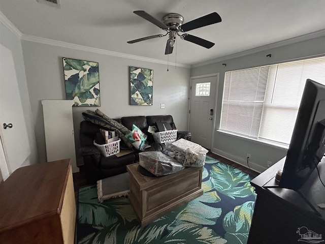 living room with ornamental molding and ceiling fan