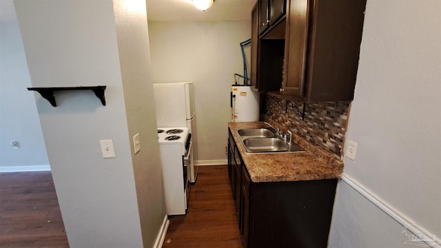 kitchen with white range with electric cooktop, gas water heater, sink, and dark wood-type flooring