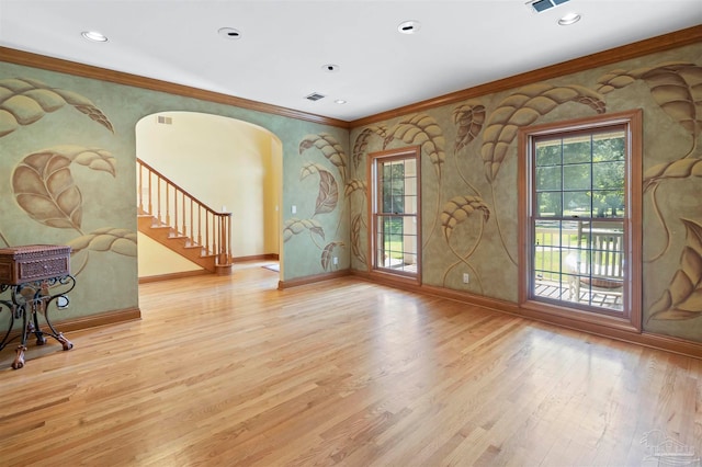 living room featuring ornamental molding and light wood-type flooring