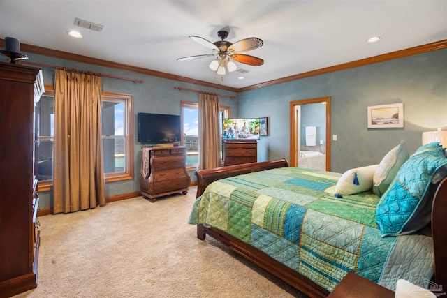 carpeted bedroom with ceiling fan, ornamental molding, and ensuite bathroom