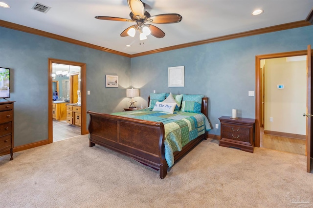 carpeted bedroom featuring ceiling fan, ornamental molding, and ensuite bathroom