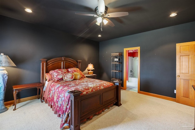 bedroom with connected bathroom, ceiling fan, and light carpet