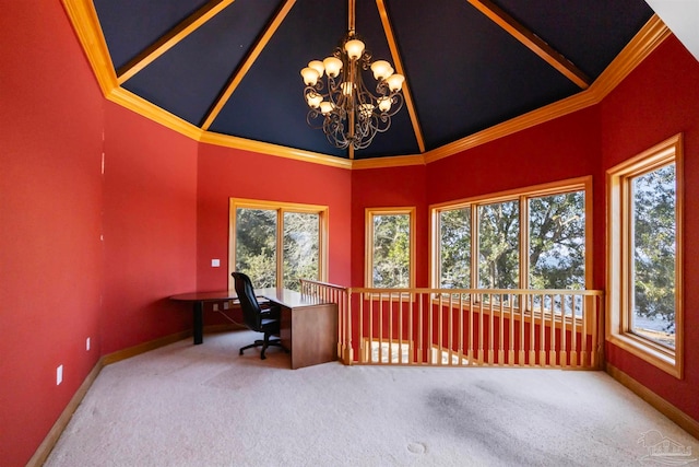 home office featuring lofted ceiling, ornamental molding, and a healthy amount of sunlight