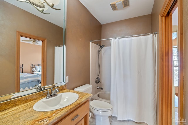 full bathroom featuring shower / bath combo, toilet, ceiling fan, vanity, and tile patterned flooring