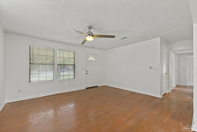 204 Chaseville St, Pensacola, FL 32507 - entrance foyer with a ceiling fan, wood finished floors, a textured ceiling, and baseboards