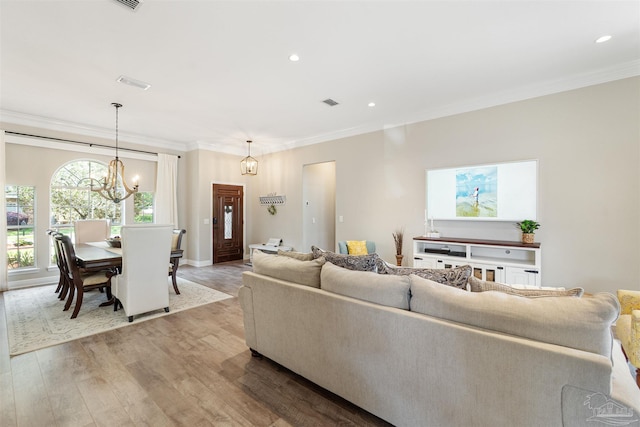 4282 Walden Way, Gulf Breeze, FL 32563 - living area featuring crown molding, wood finished floors, a chandelier, recessed lighting, and baseboards