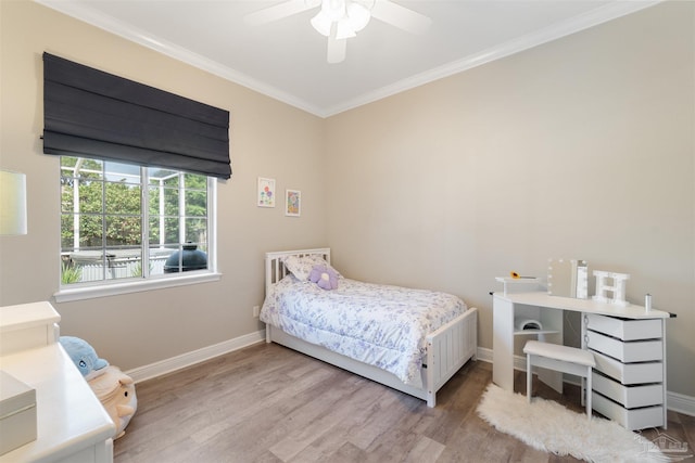 4282 Walden Way, Gulf Breeze, FL 32563 - bedroom with wood finished floors, baseboards, crown molding, and ceiling fan