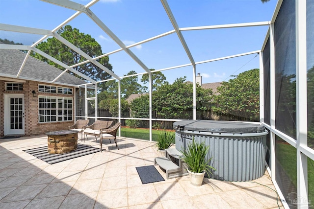 4282 Walden Way, Gulf Breeze, FL 32563 - fenced backyard featuring a hot tub, a fire pit, a patio area, and glass enclosure