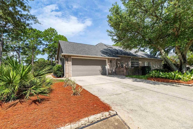 4282 Walden Way, Gulf Breeze, FL 32563 - view of front of house featuring brick siding, an attached garage, driveway, and a shingled roof